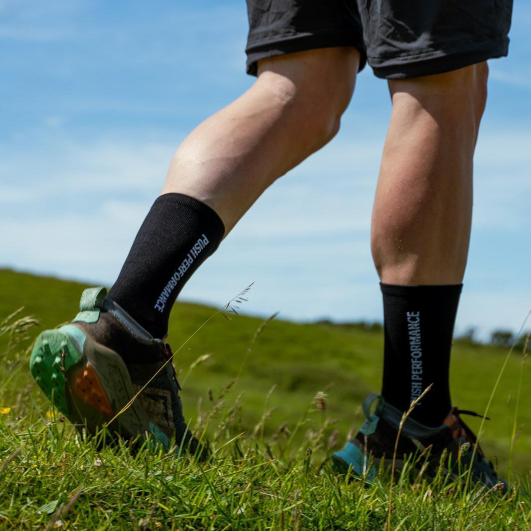 Black running socks on foot.