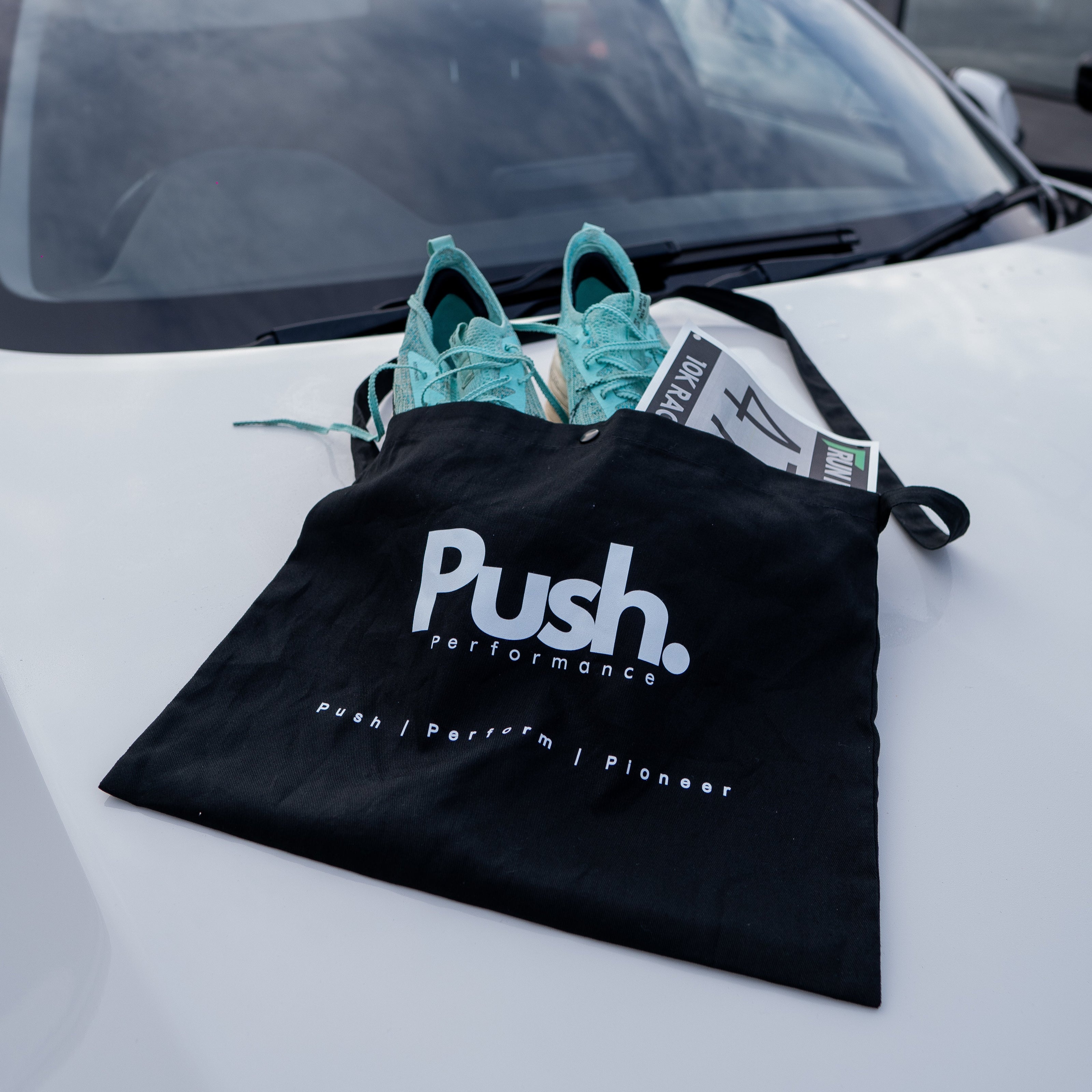 Close-up of the adjustable strap and secure fastener on the Musette Bag for comfortable wear.