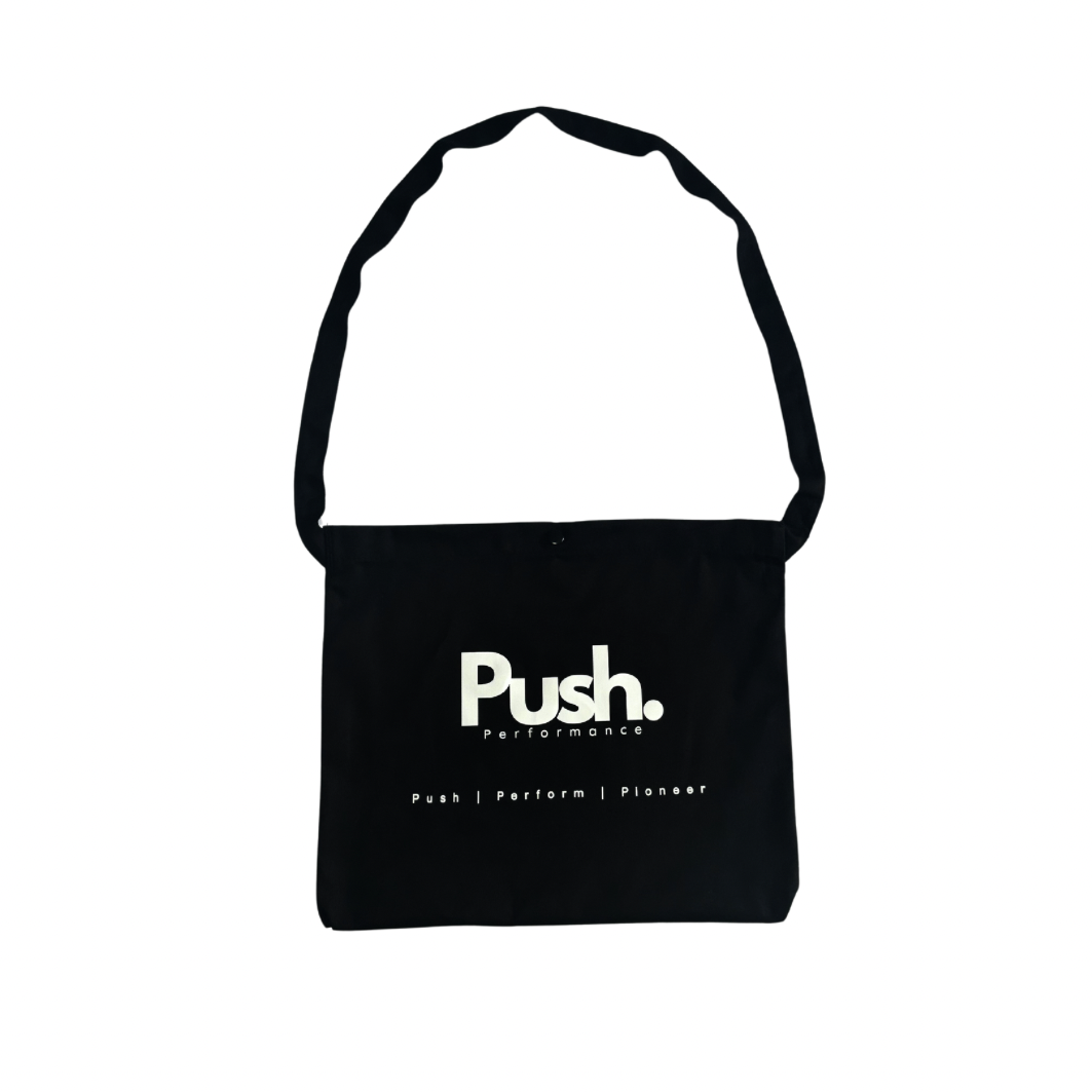 Front view of the Push Performance Musette Bag, featuring a minimalist design with durable straps.