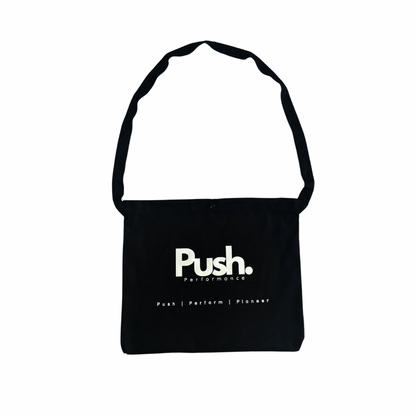 Front view of the Push Performance Musette Bag, featuring a minimalist design with durable straps.