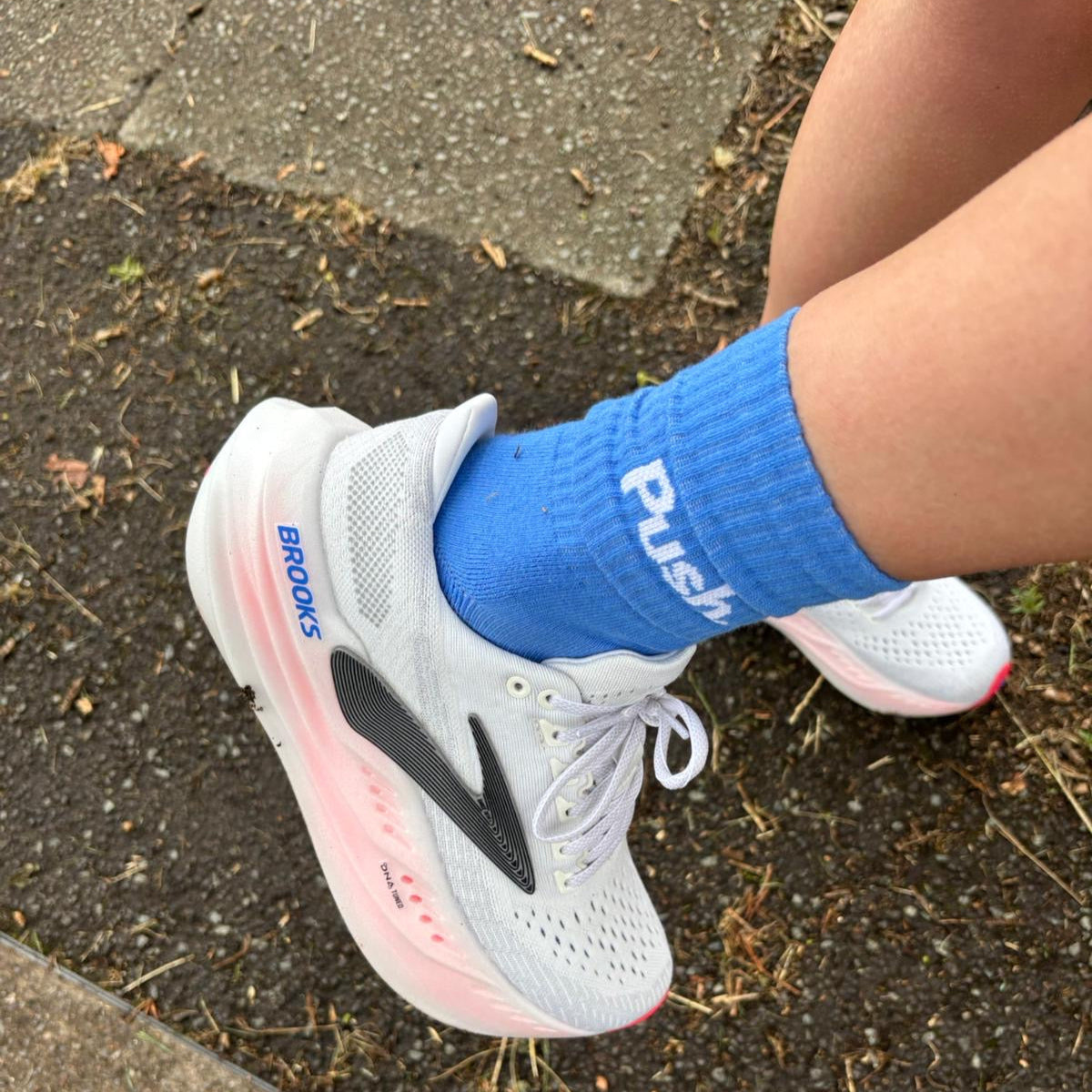 Blue training running socks on feet.