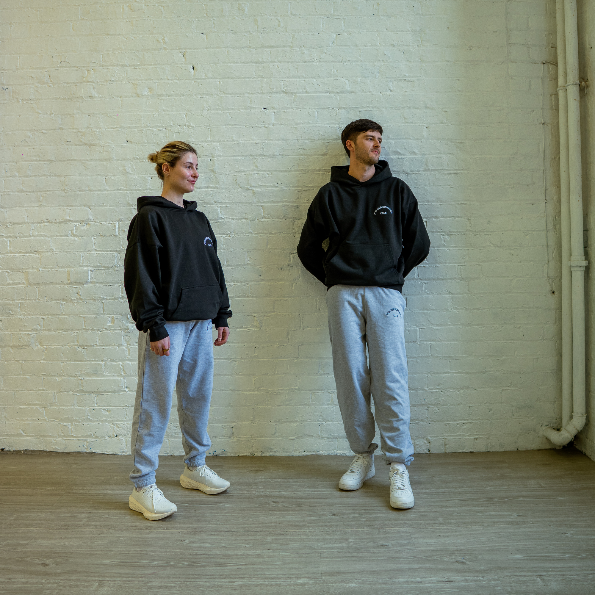 Close-up of elastic waistband and subtle logo on black Essential Warm Up Jogger from Push Performance