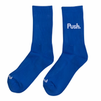 Pair of blue training socks with 'Push.' logo on a white background