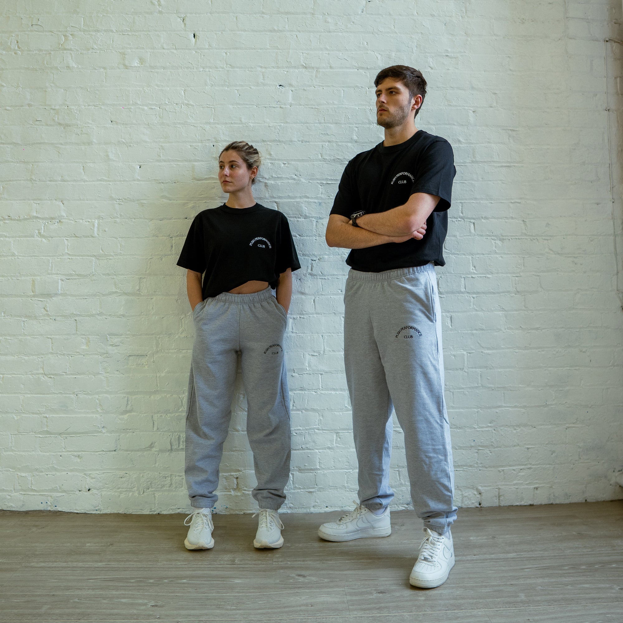 Push Performance black tee styled for casual streetwear, bridging athletic performance and minimal design