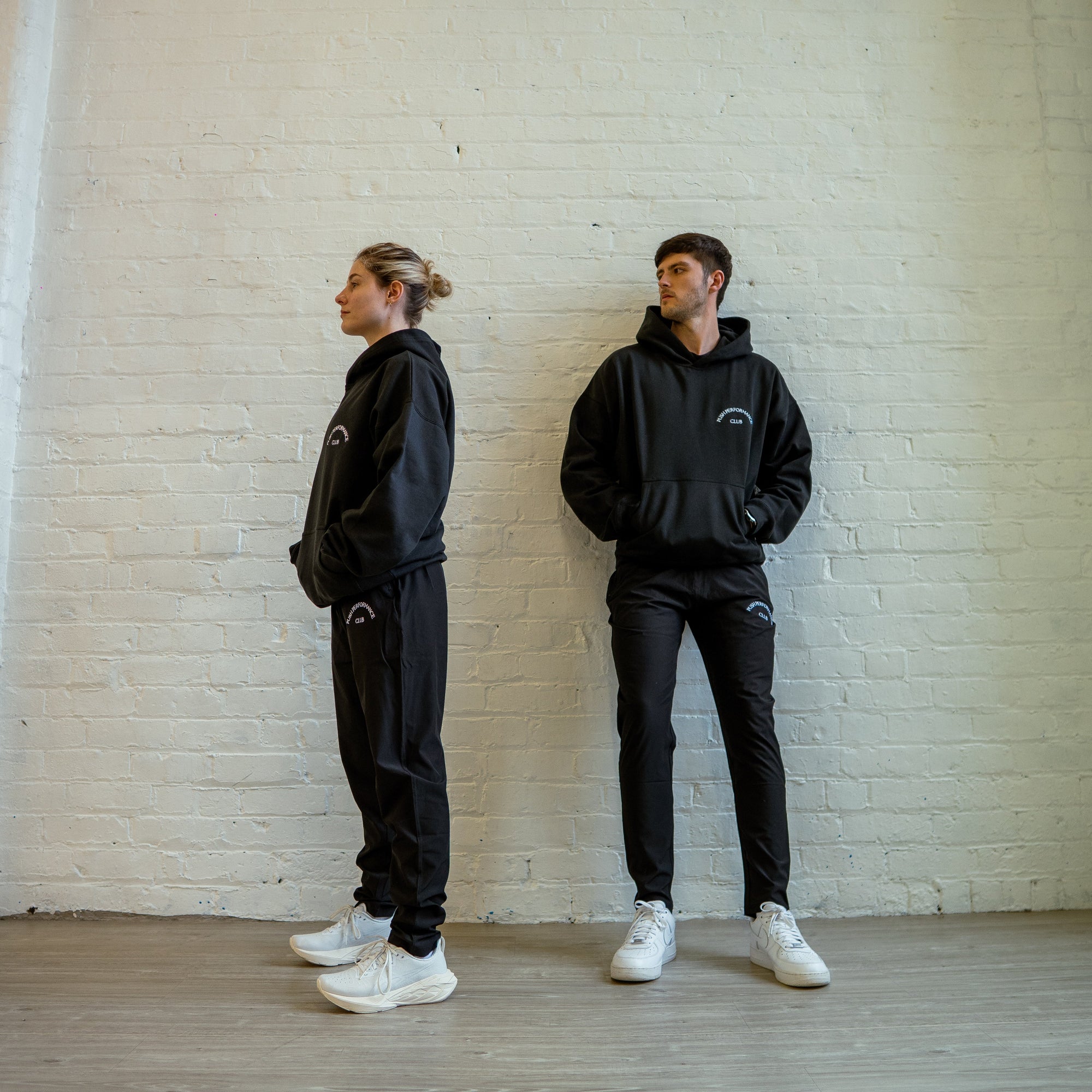 Push Performance black training pants styled in active urban setting, blending function and everyday comfort