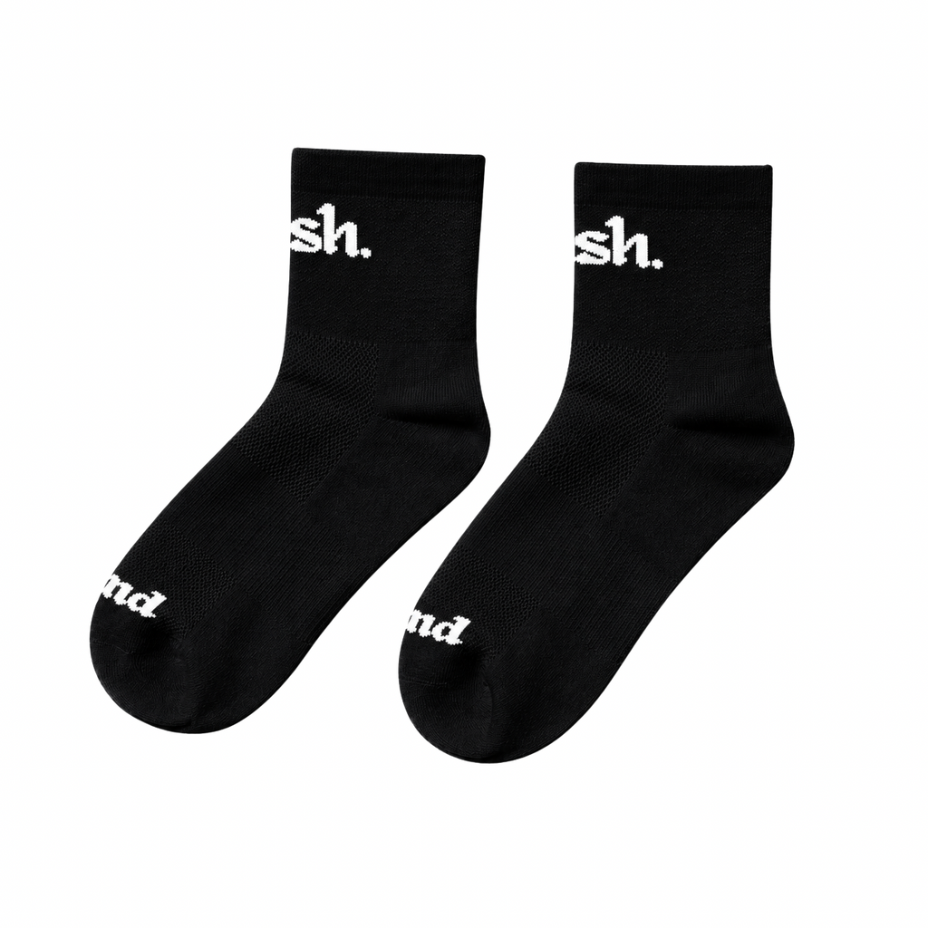 Push performance Black quarter length running socks with white text on a white background