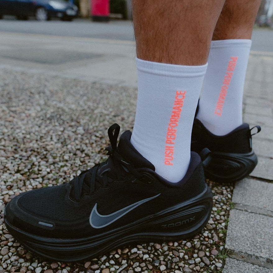 push performance white and orange  anti-blister running socks on runner